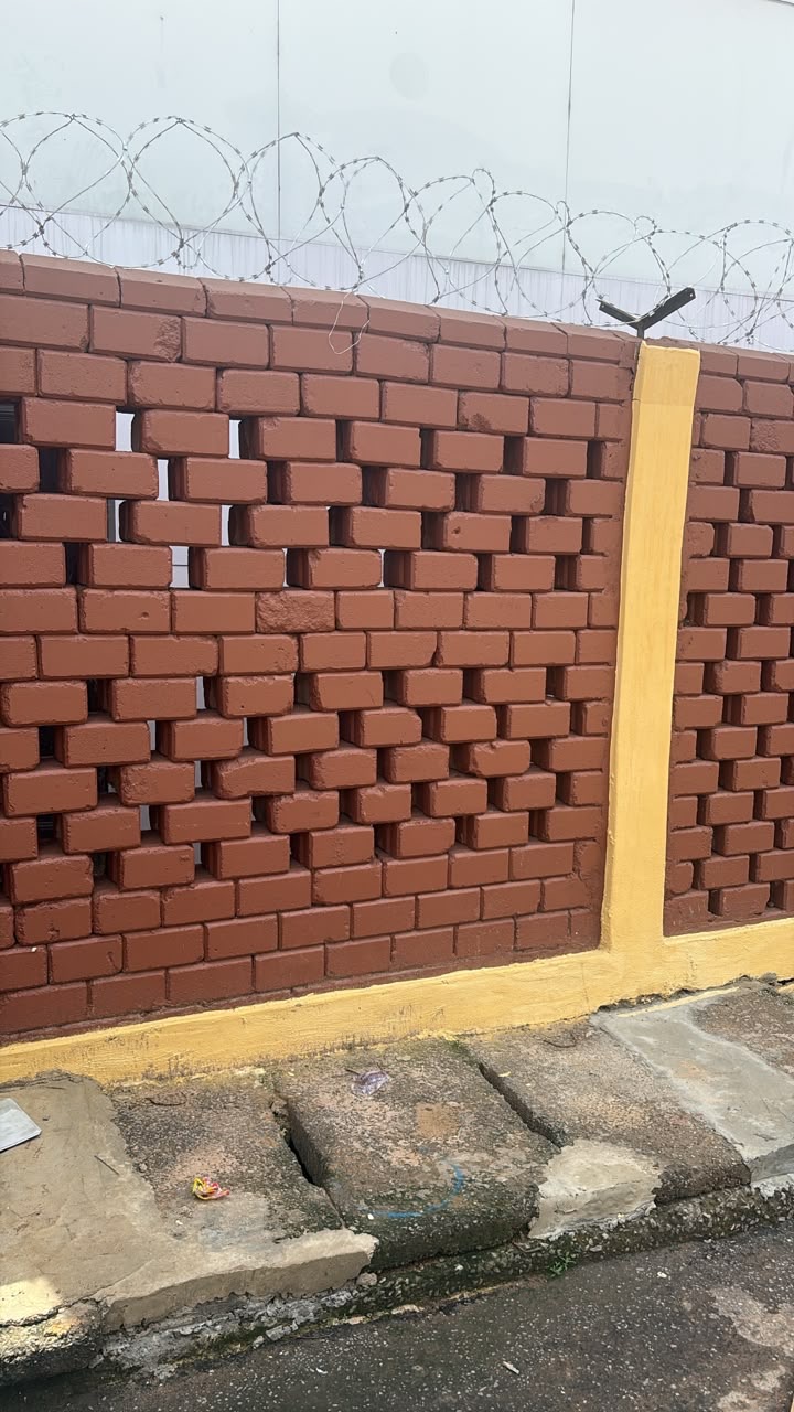 Illuminated laterite brick boundary wall